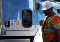 A utility worker outside a truck