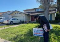 San Jose Councilmember Sergio Jimenez is pictured placing a yard sign in front of a District 2 home. Photo by Nadia Lopez.