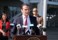 Man standing at microphones