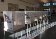 A row of voting booths on Election Day