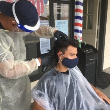 Haircuts and pedicures on Santa Clara sidewalks raise new challenges