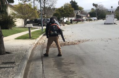 A person using a leaf blower on a street in San Jose, California