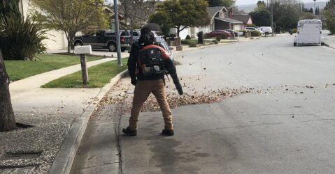 A person using a leaf blower on a street in San Jose, California