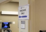 A 'vaccines only' sign is displayed outside the room where health care workers are receiving the first doses of the COVID-19 vaccine at O'Connor Hospital in San Jose, Calif. Photo by Vicente Vera.