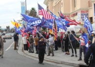 Supporters of President Donal Trump wave flags outside