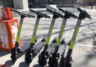A row of electric scooters on the street
