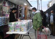People line up for food and other services on the sidewalk just outside community service nonprofit CityTeam's San Jose center Dec. 25. File photo by Vicente Vera.
