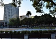 People riding their bikes through a plaza in downtown San Jose, California