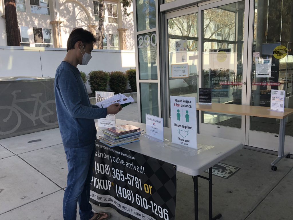 Victor Kim returns books to the Santa Teresa Branch of the San Jose Public Library. Photo by Lorraine Gabbert.