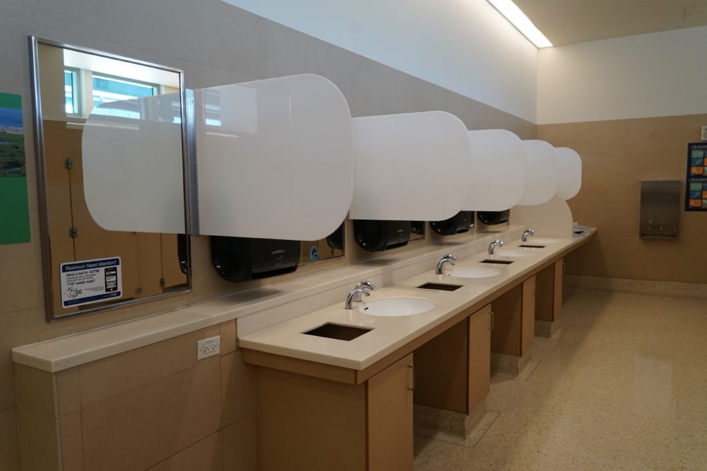 COVID protocols at San Jose International Airport include dividers between bathroom sinks. Photo courtesy of Norman Y. Mineta-San Jose International Airport.