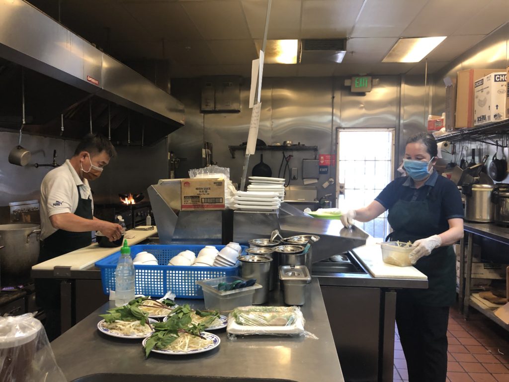 Heng and Huyen, two employees at Pho Y #1 Noodle House, prepare a lunch order. Photo by Patricia Wei.