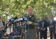 The former sheriff of Santa Clara County, Laurie Smith, speaks into microphones at a press conference after the VTA mass shooting on May 26, 2021.
