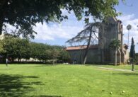 A grass field in front of a building on campus at San Jose State University