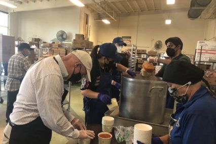 People package soup for people in need in San Jose, California