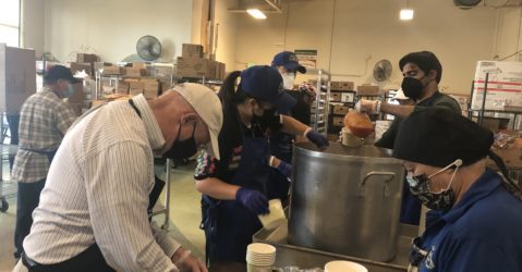 People package soup for people in need in San Jose, California