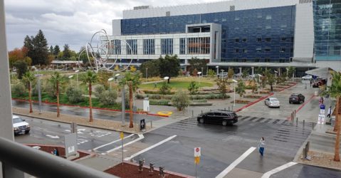 Cars driving by a hospital in San Jose, California