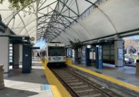 A light rail train pulling into a station