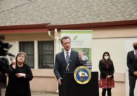 California Governor Gavin Newsom stands at a podium in San Jose