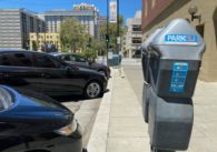 Parking meters next to a row of cars in San Jose, California