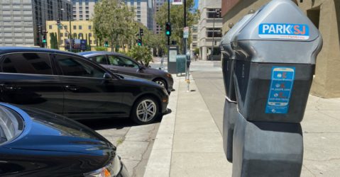 Parking meters next to a row of cars in San Jose, California
