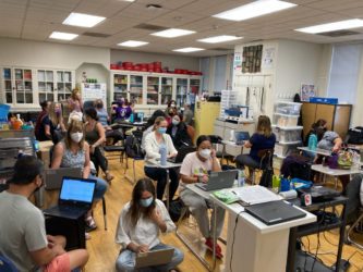 SEIU paraeducators A group of special education teachers wearing face masks working in a classroom