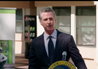 California Governor Gavin Newsom stands at a podium in San Jose
