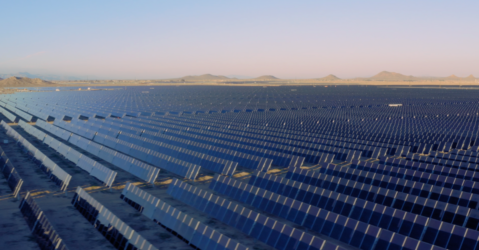 Rows of solar panels stretching to the horizon line