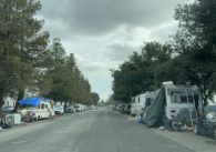 RVs line a street in an industrial area of San Jose