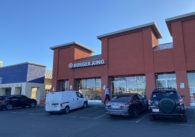 Vehicles parked in front of a Burger King location