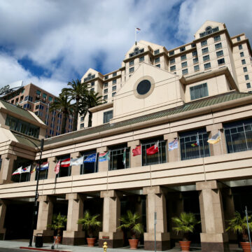 The exterior of a large hotel in downtown San Jose, California