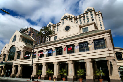 The exterior of a large hotel in downtown San Jose, California