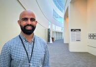 A man stands in the hallway of San Jose City Hall