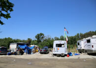 A homeless encampment comprised of cars and RVs