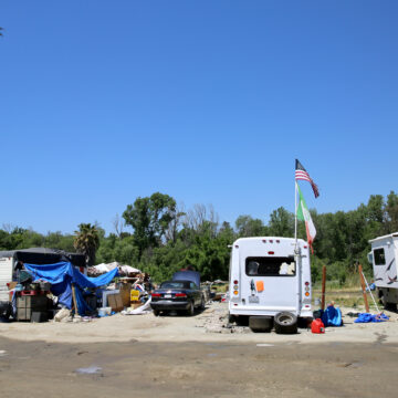 A homeless encampment comprised of cars and RVs