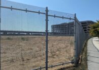 A plot of land behind a fence