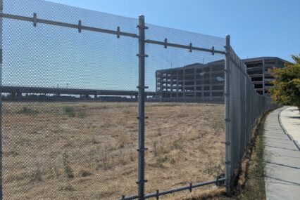 A plot of land behind a fence