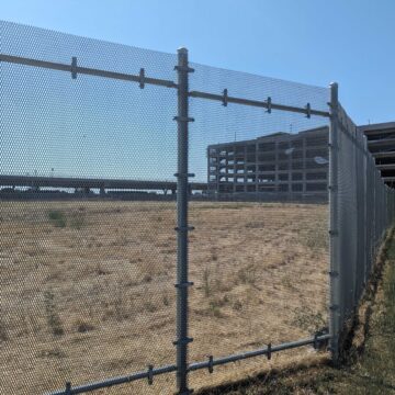 Berryessa-VTA-lot -2 Empty land behind a fence near a transit stop in San Jose, California