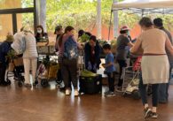 People waiting in line at a food distribution event