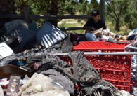 An abandoned shopping cart full of trash