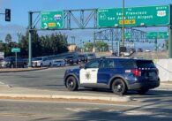 A police car sits at an intersection in San Jose, California
