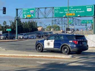 A police car sits at an intersection in San Jose, California