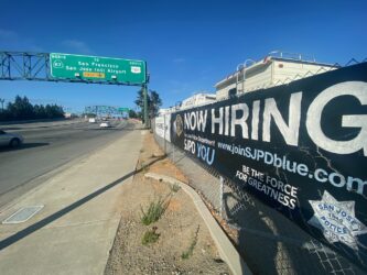 SJPD hiring A police recruitment banner along the side of a street