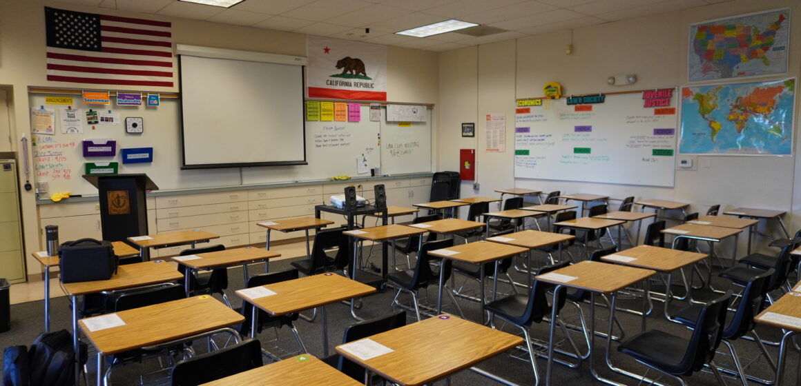 Rows of desks in an empty classroom