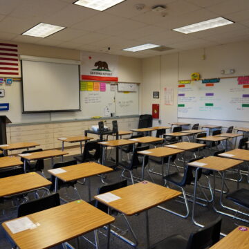 STATE SUSPENSION LAW Rows of desks in an empty classroom