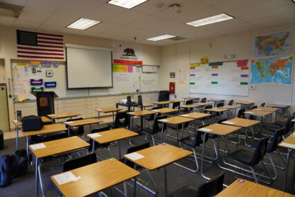 Rows of desks in an empty classroom
