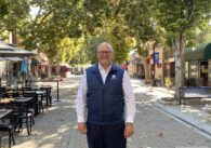 Russ Melton posing in front of Murphy Avenue in Sunnyvale
