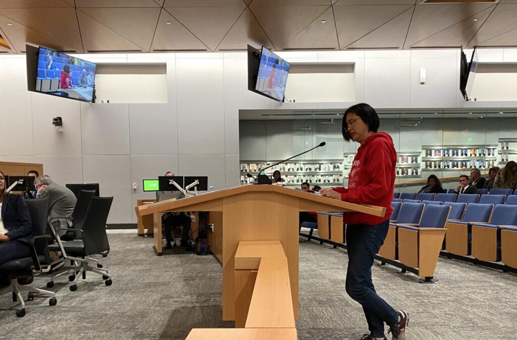 Sunnyvale Alliance Soccer Club Vice President Haruko Matsuda speaking at the Sunnyvale city hall podium during the city council meeting.