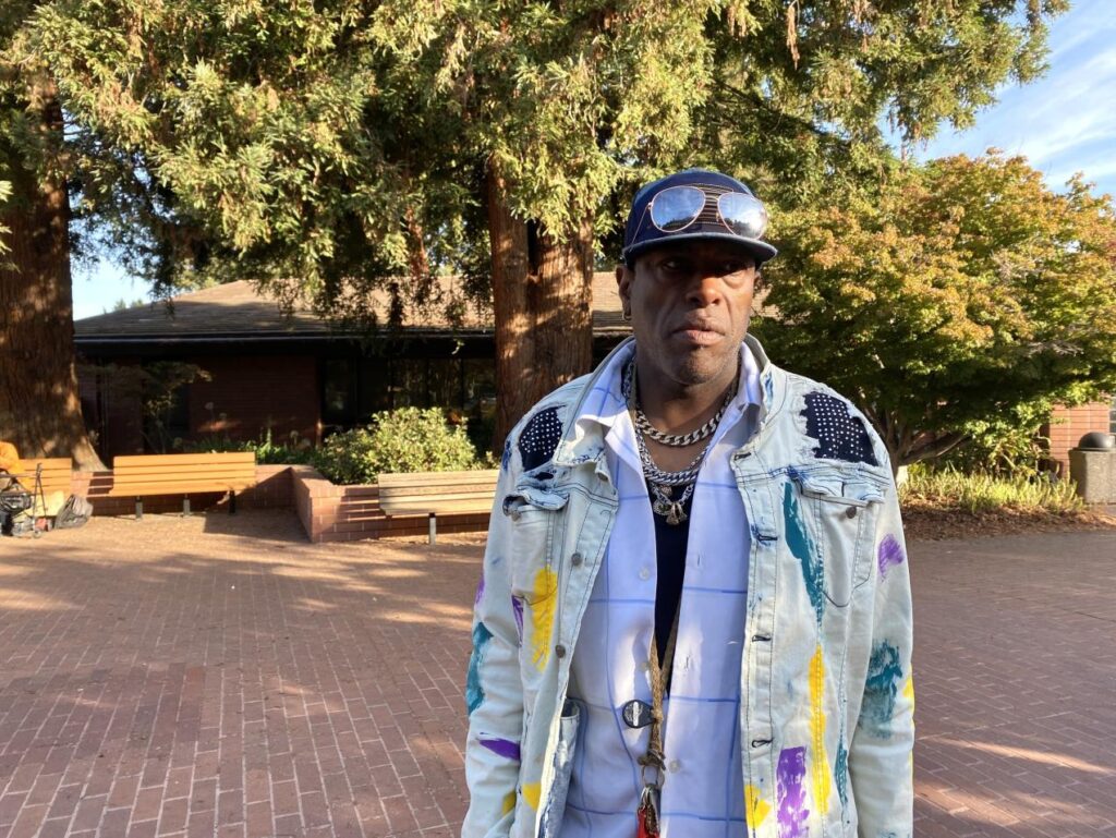 Former HomeFirst employee Michael Love standing in front of the Sunnyvale Public Library.