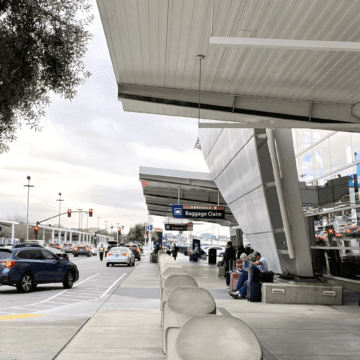 Cars pulling in at the loading and unloading curb by San Jose airport