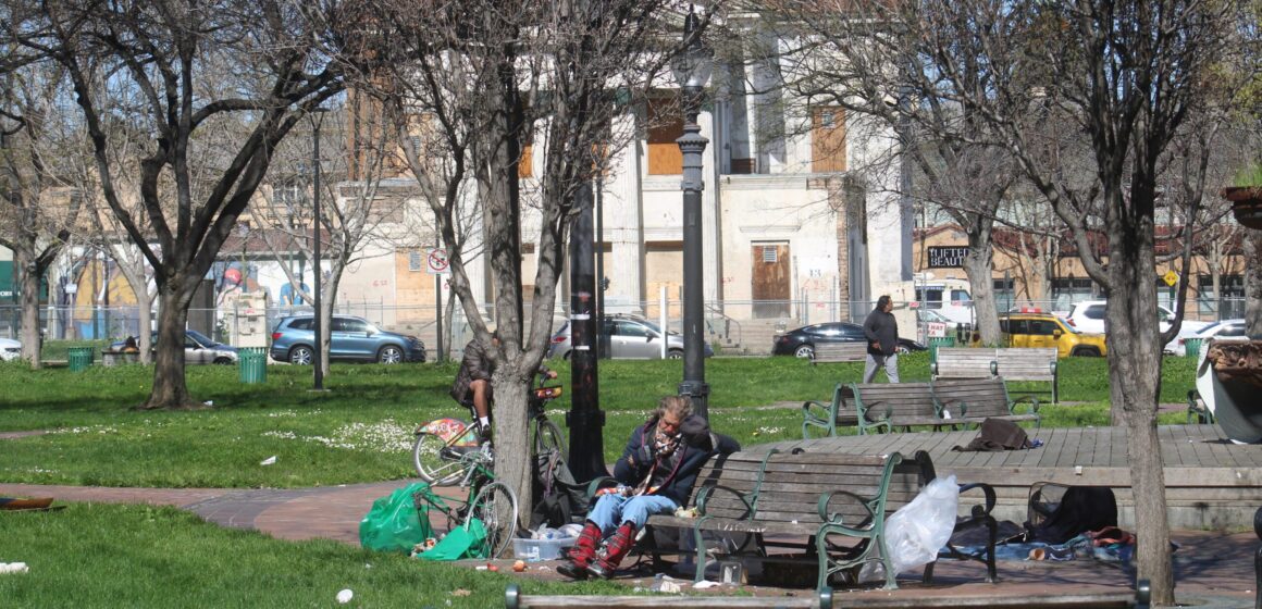 St. James Park A homeless person sitting on a park bench in San Jose, California